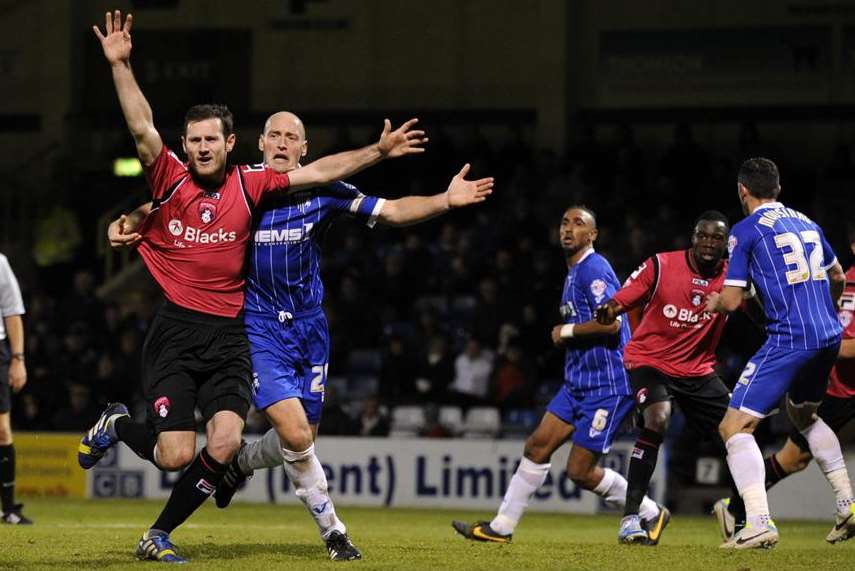 The Gillingham defence looks to mark tight at this Oldham attack. Picture: Barry Goodwin