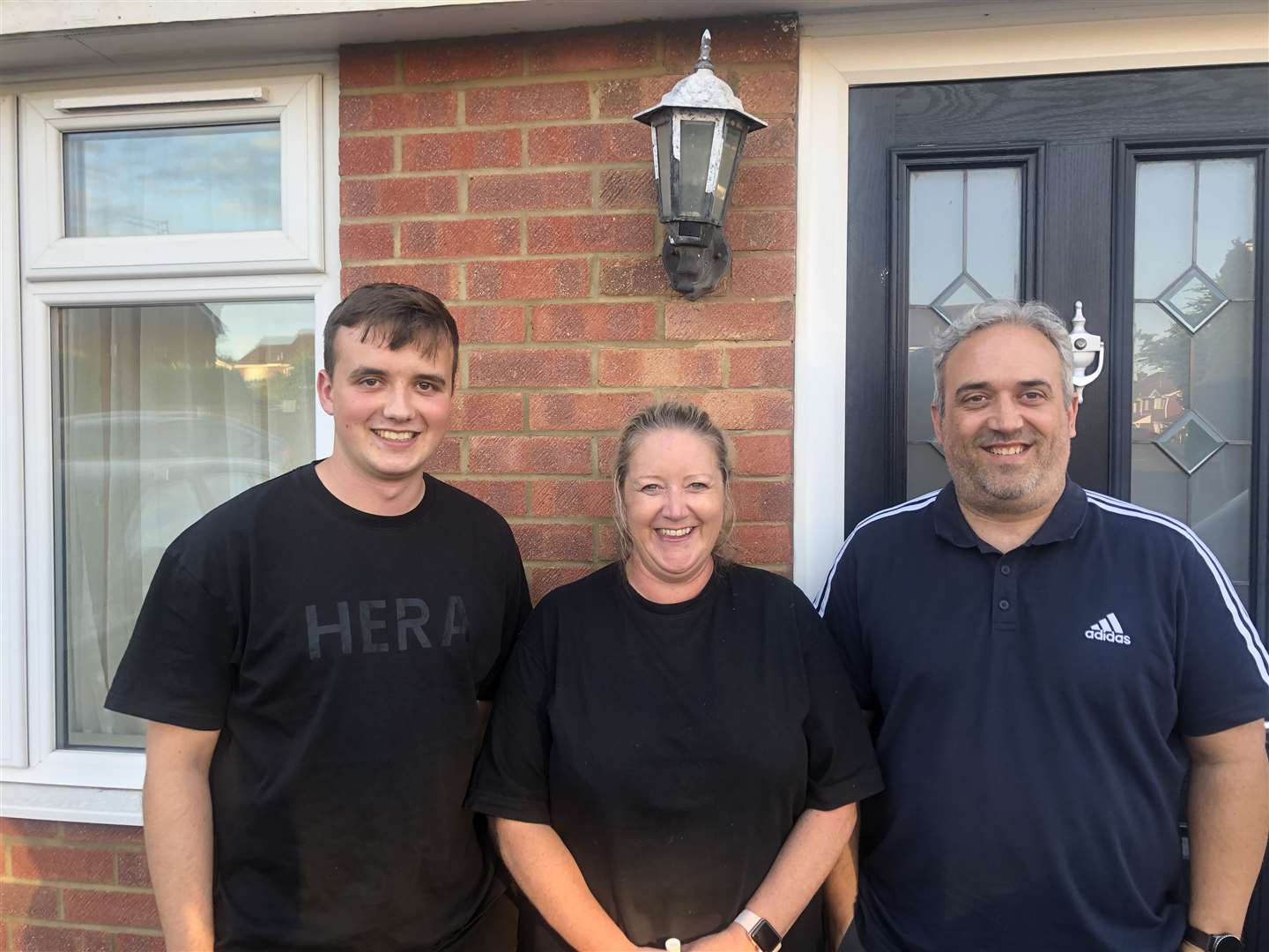 From left: Luke, Emma, and Kevin Eagle outside their home in Northfleet