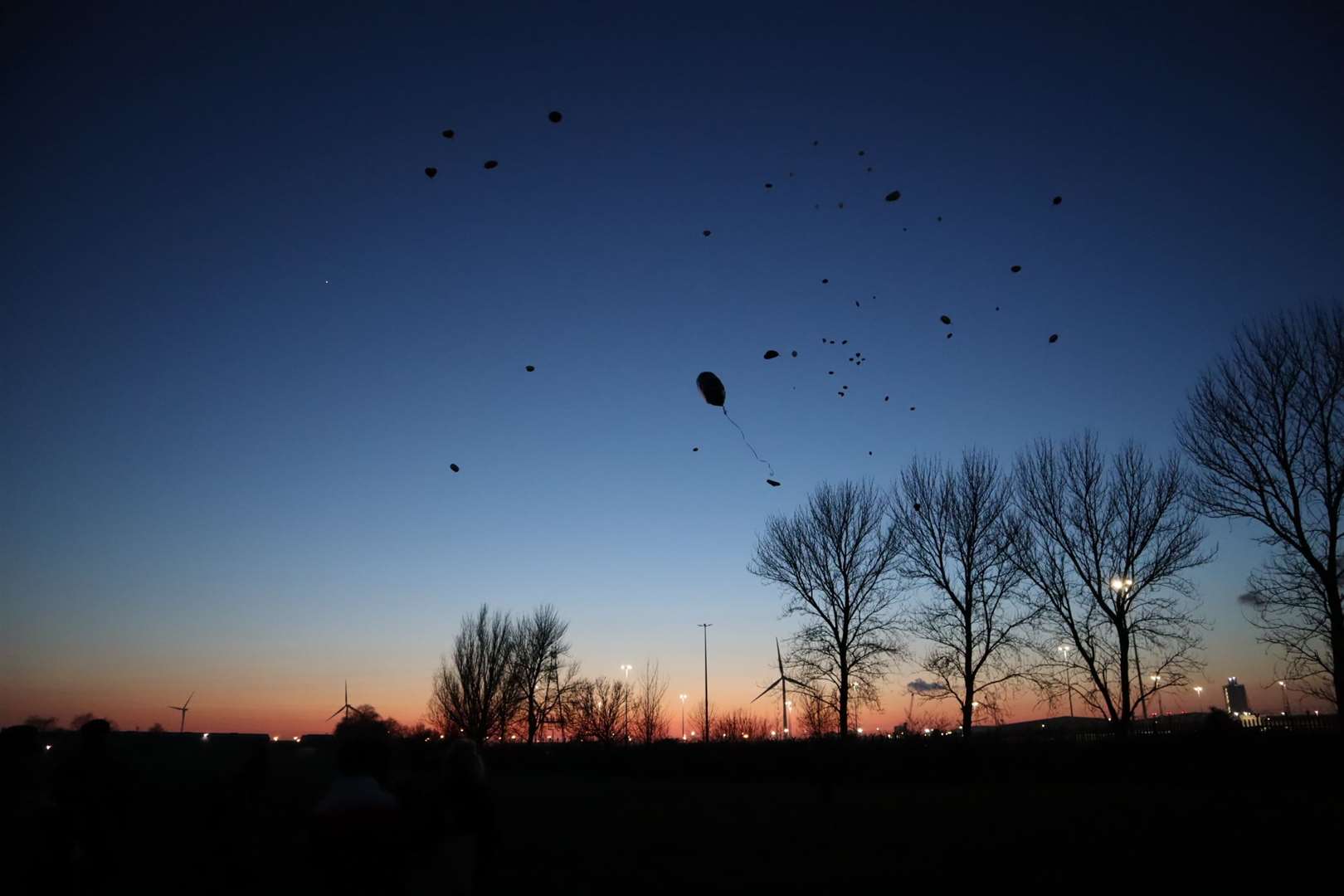 Balloons fill the sky at Emre Huseyin's vigil in New Road playing fields, Sheerness, on Thursday. It would have been his 16th birthday (28589026)