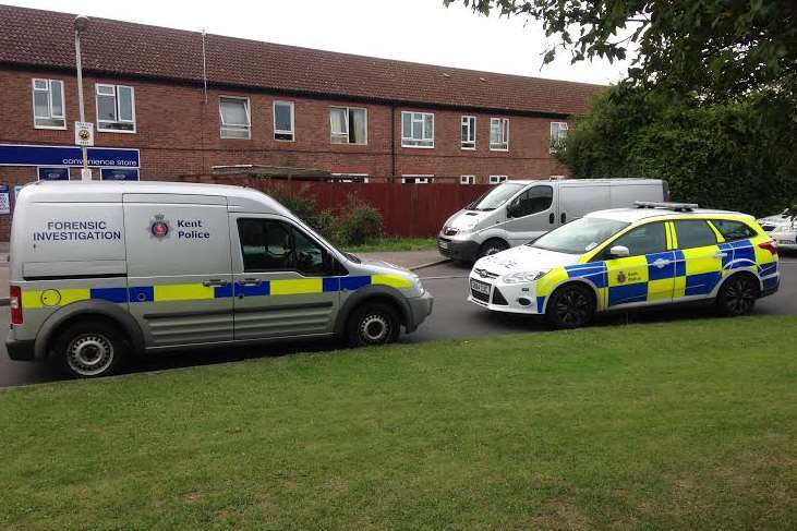 Forensics vans are among the emergency vehicles in Wildish Road
