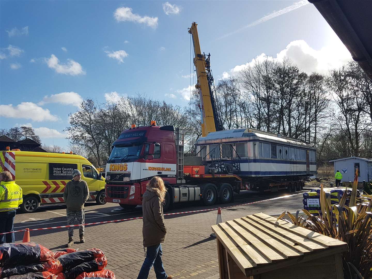 A crane lifted the structure and its base onto lorries before they were hauled away