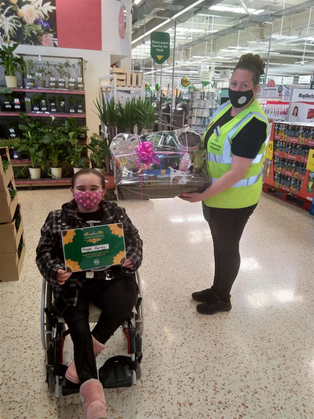 Angel Farley receiving her certificate and goodies from Morrisons in Sittingbourne