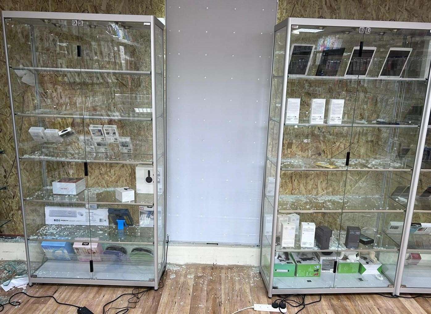 Some of the cabinets in Fone Fix were smashed during the burglary. Picture: Deepak Dhall