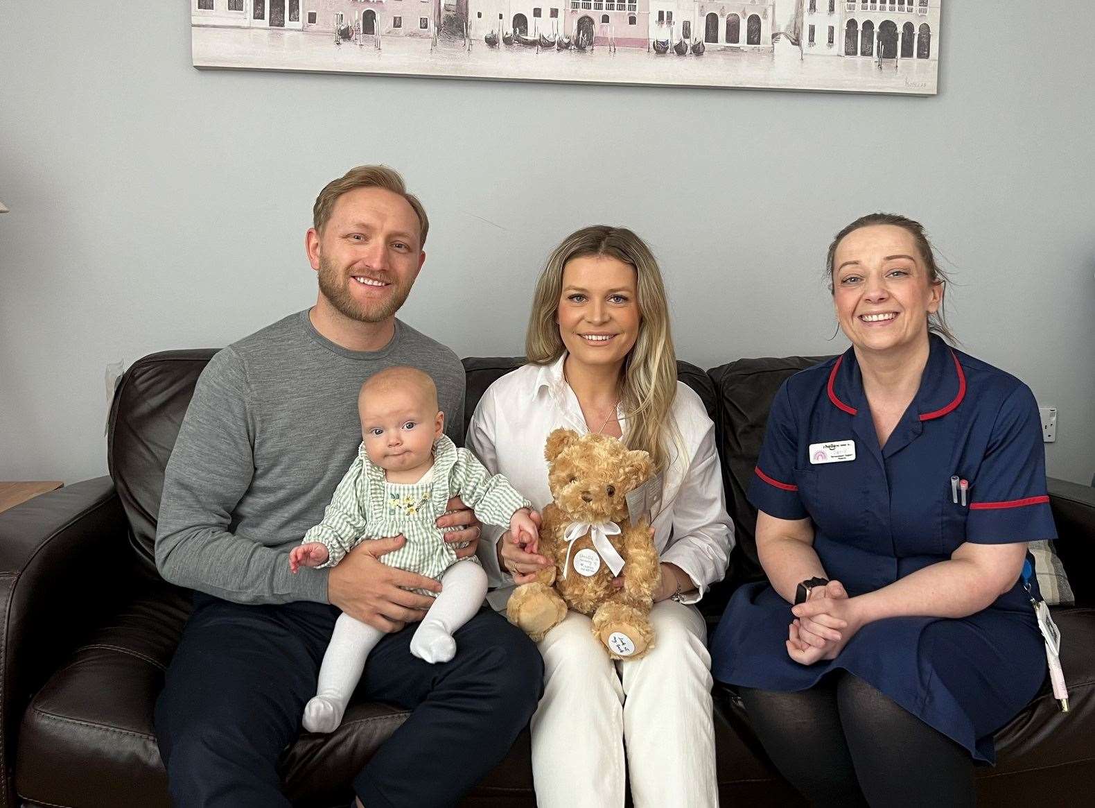Jim and Pheobe made a special donation to help other parents experiencing child loss. They are pictured with their daughter, Primrose, and bereavement support midwife, Danielle Burnett