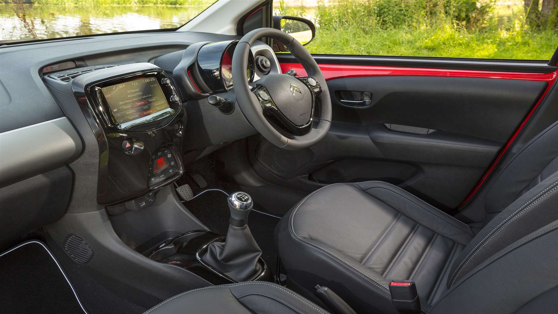 The high gloss interior with leather steering wheel and chrome gear lever add some style to the C1