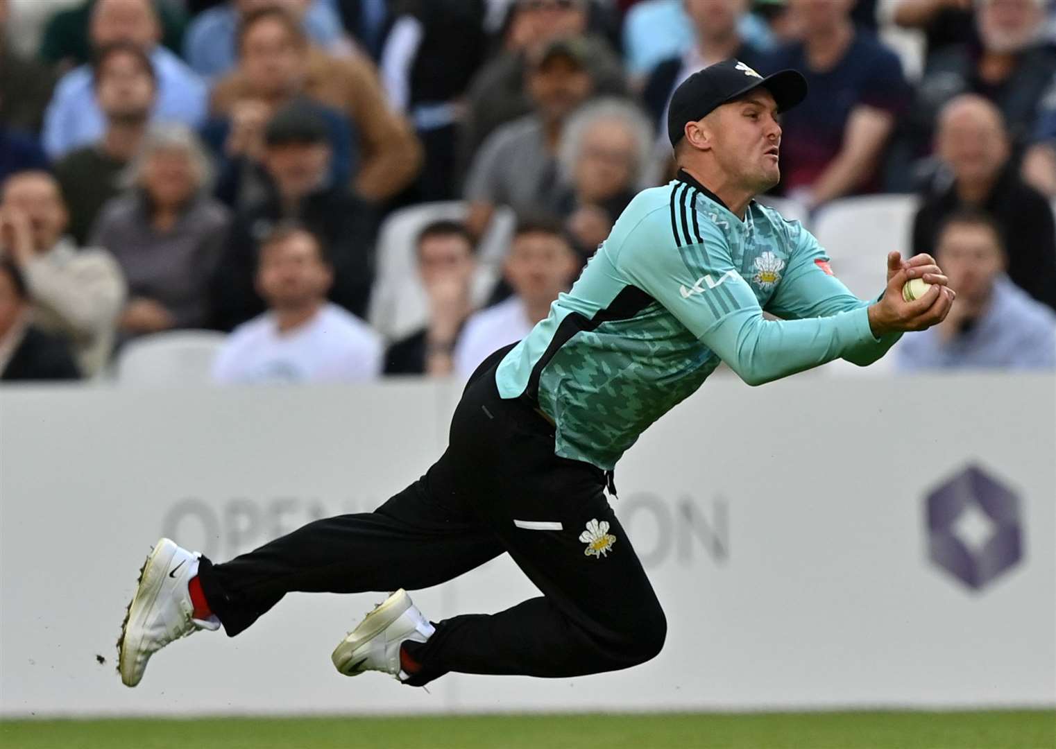 Surrey's Jason Roy holds on to remove Jordan Cox. Picture: Keith Gillard
