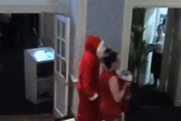 CCTV proof of Santa at the Hythe ImperiaL Hotel on Christmas Day, with a member of staff carrying presents.
