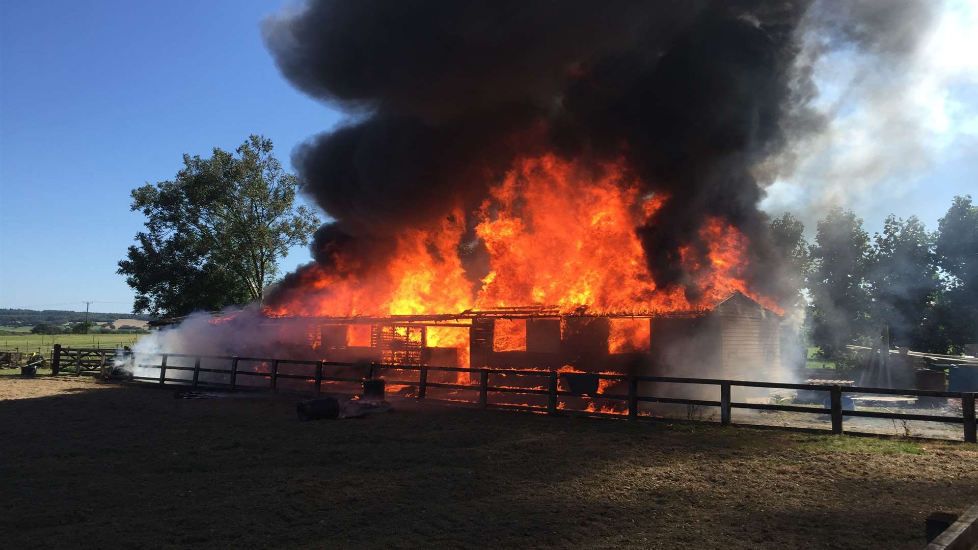 Fire rips through buildings at the Modha's smallholding in Woodchurch destroying a hay store and stables