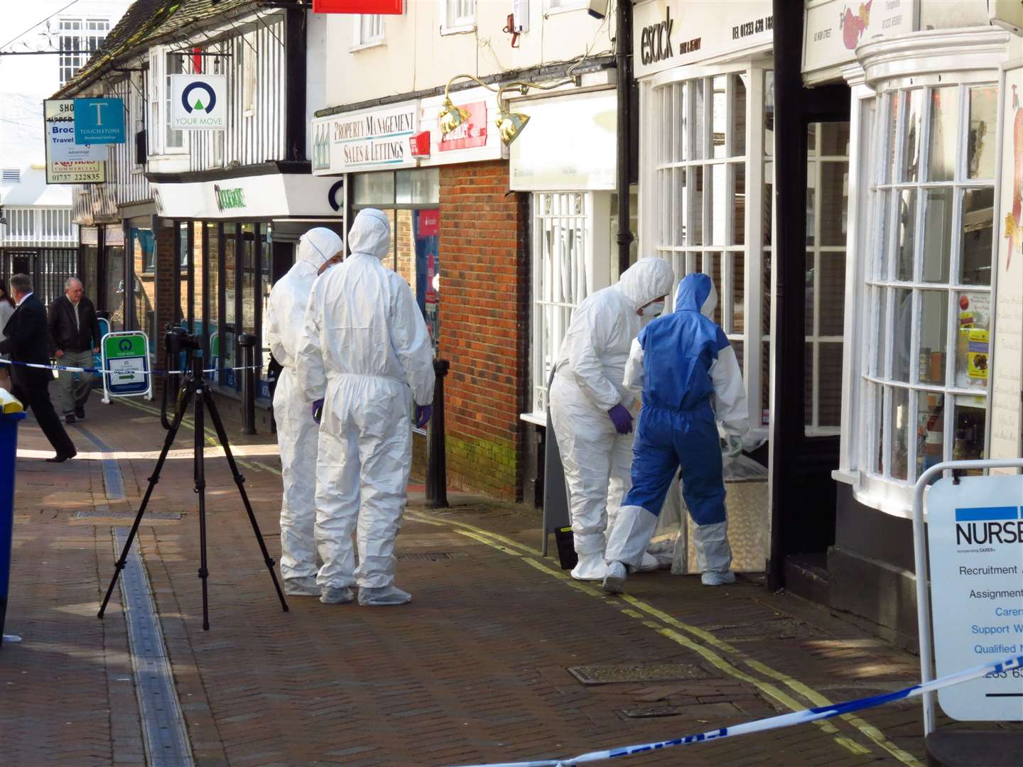 Forensics officers at the scene of the murder. Picture: Andy Clark
