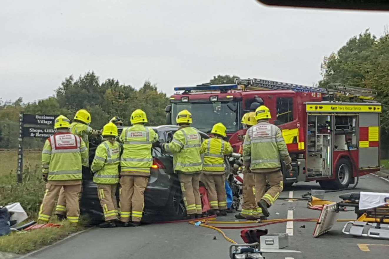 Fire crews cut the VW driver from his car. Picture: Paula Tozer