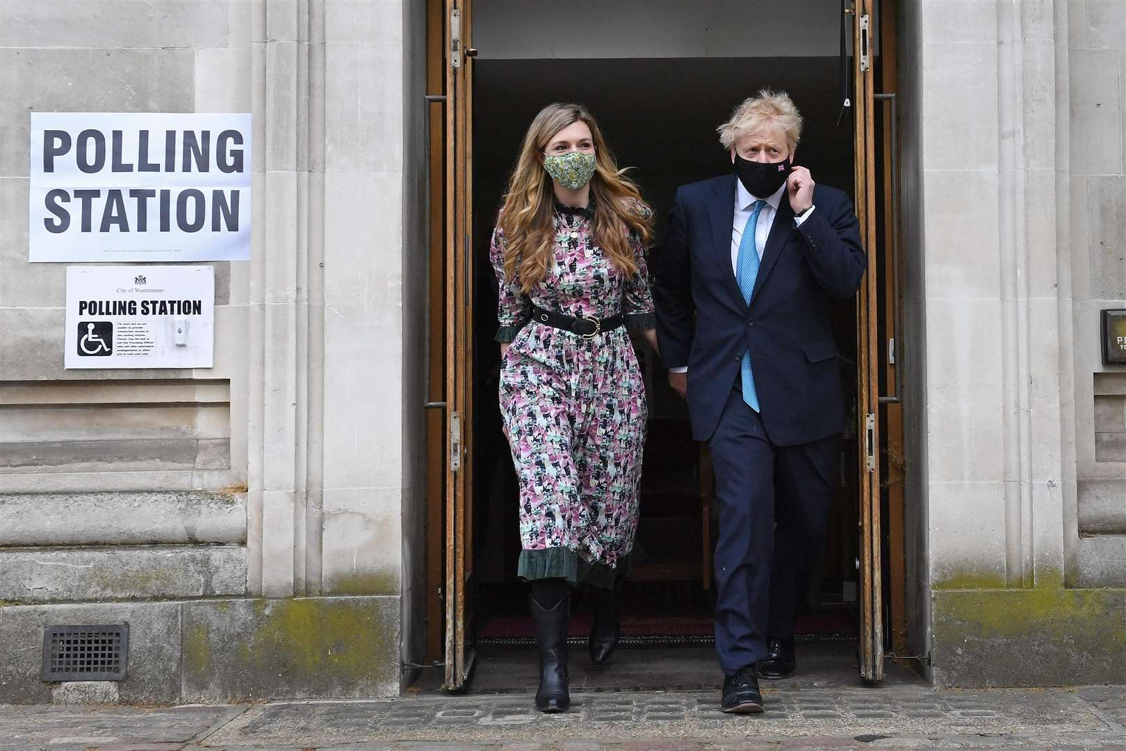 Prime Minister Boris Johnson and his fiancee Carrie Symonds leave after casting their vote at Methodist Central Hall, Westminster (Stefan Rousseau/PA)