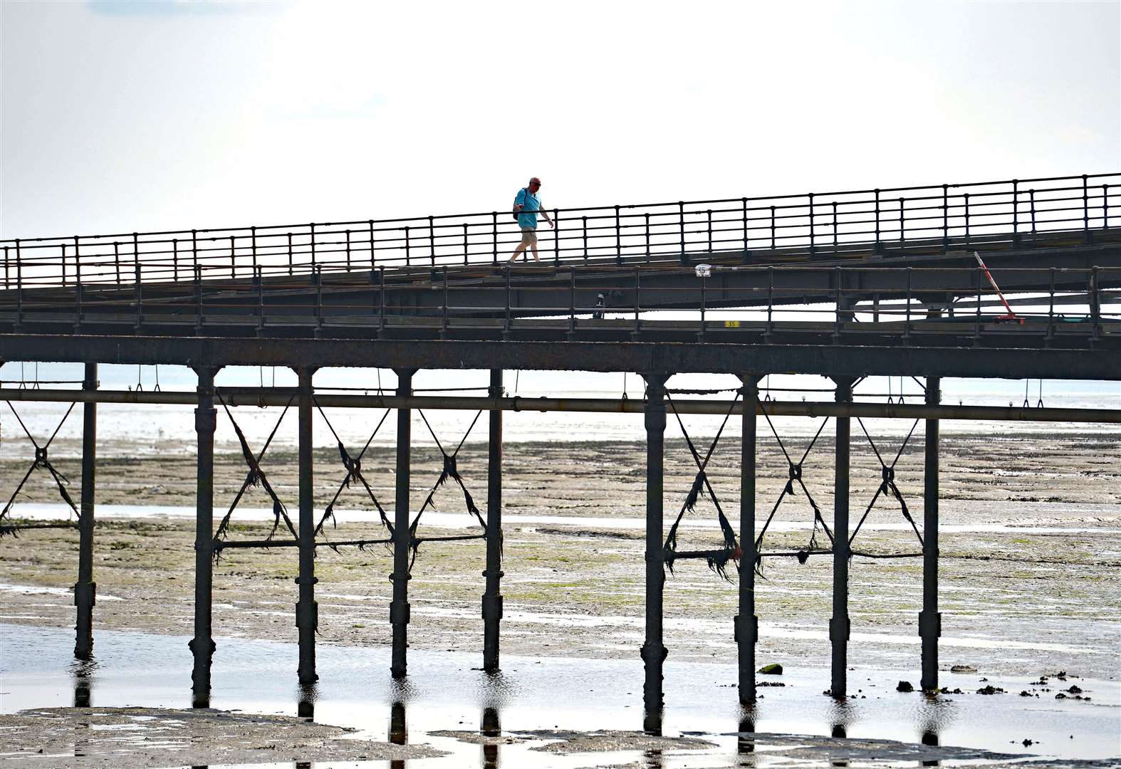 A person enjoys a walk along Southend Pier (PA)
