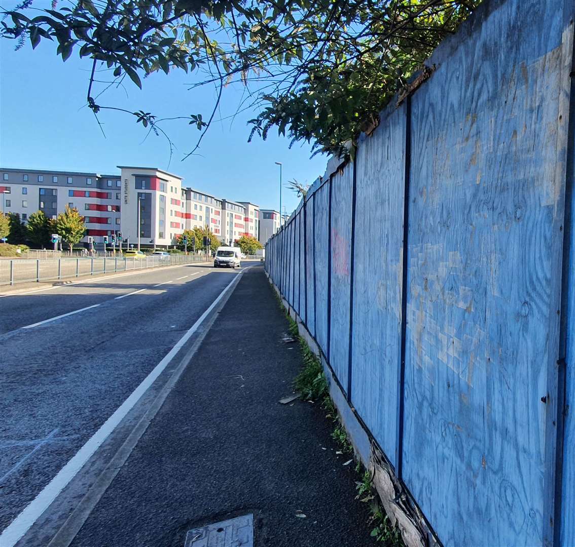 The fading blue hoardings in Pier Road, Gillingham