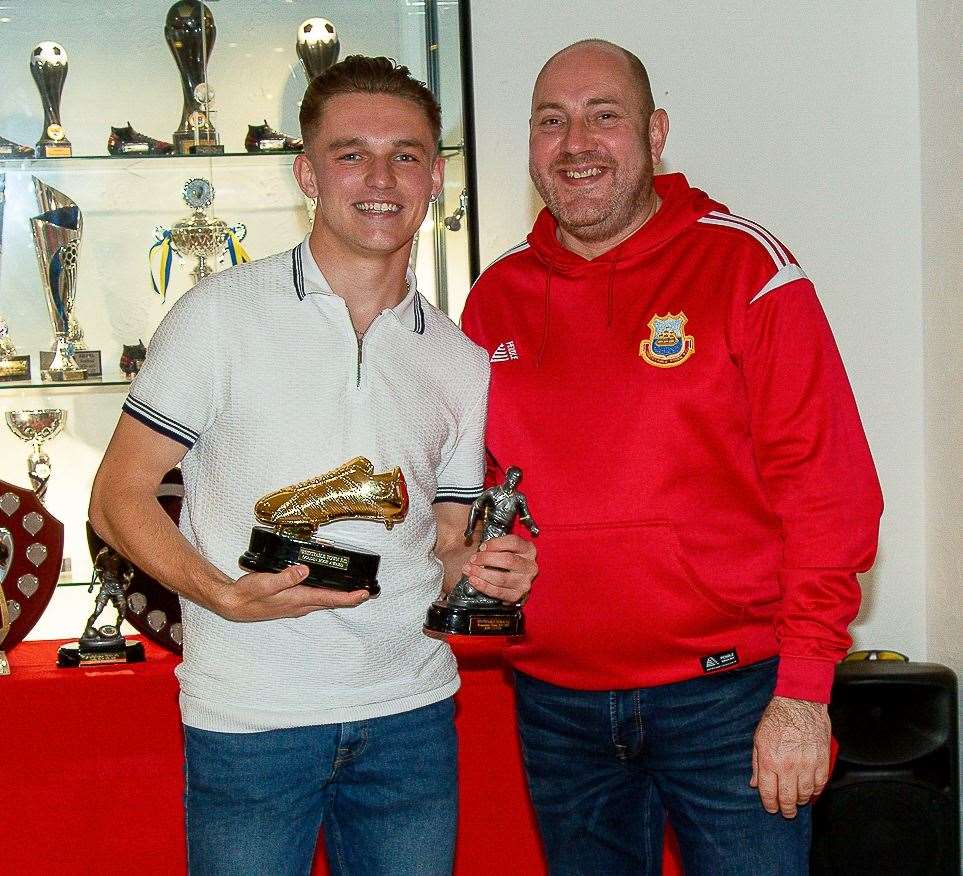 Josh Oliver, seen here receiving the golden boot from Whitstable chairman Steve Clayton, can play a leading role in the Oystermen’s promotion bid next season. Picture: Les Biggs
