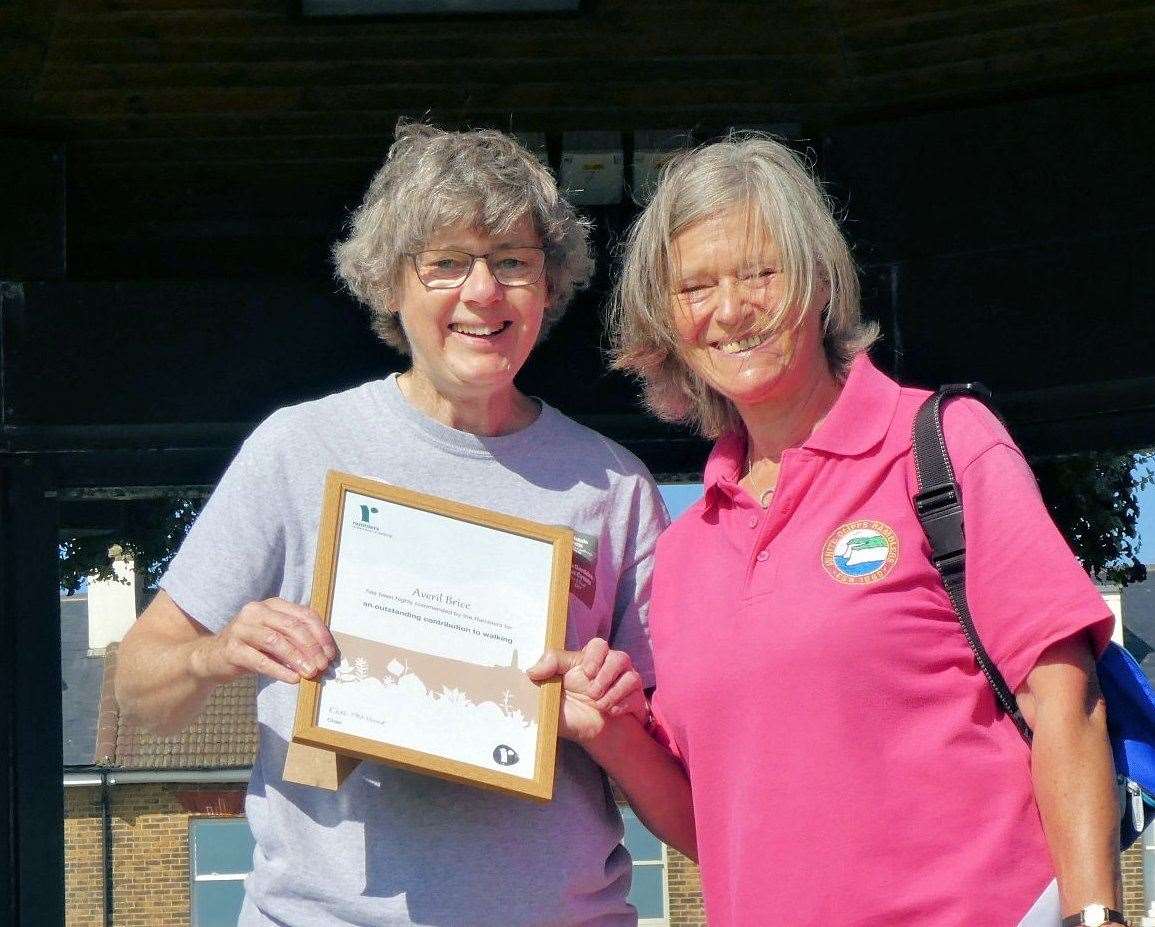 Averil Brice collecting her award for keeping footpaths open from Ramblers chairwoman Kate Ashnrook