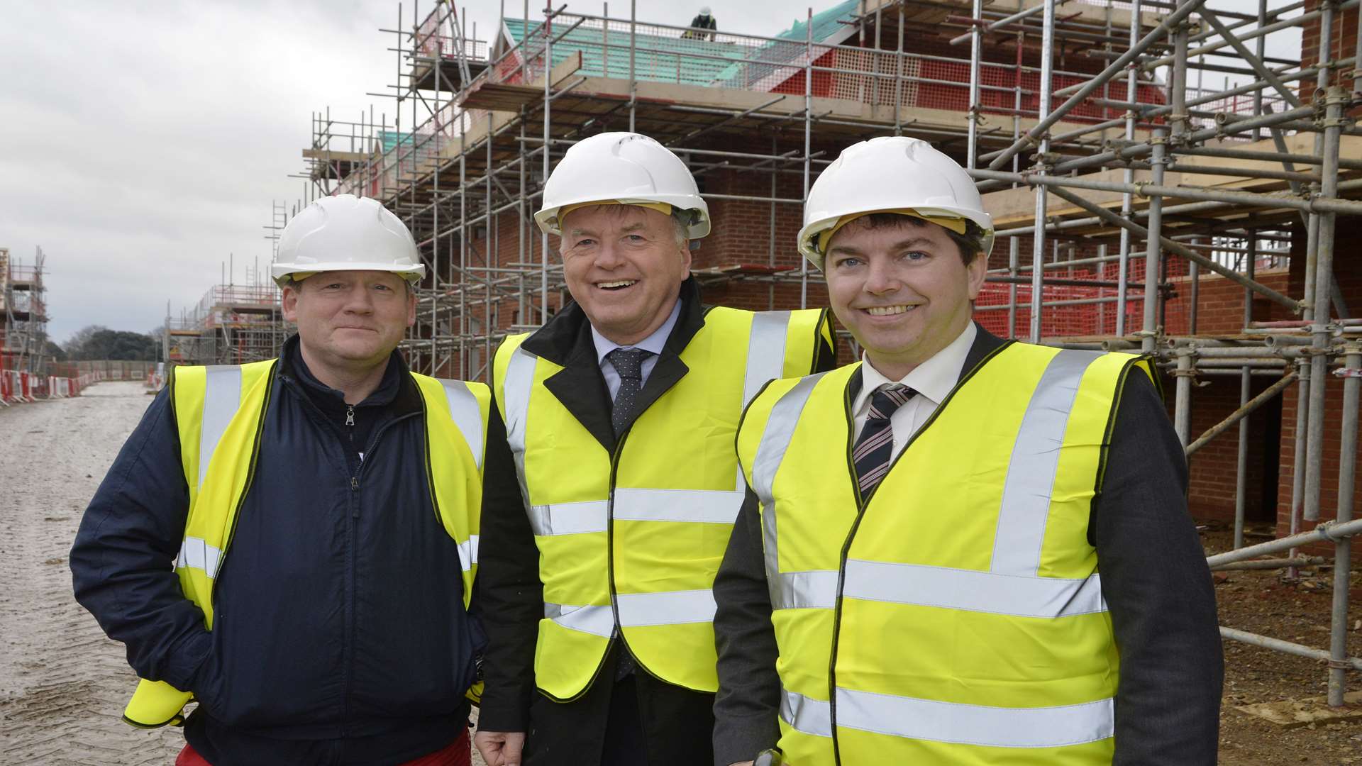 Adam Holloway, left, Paul Spooner of the EDC, centre and Gareth Johnson on site in Ebbsfleet Garden City