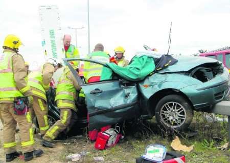 KFRS work to free people trapped in crashed car