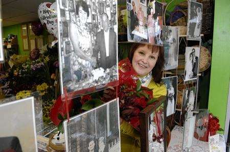 Rebeeca Green, of Flowers of Distinction in Coxheath, has a Valentine's display of local wedding photographs. Picture by Matthew Walker