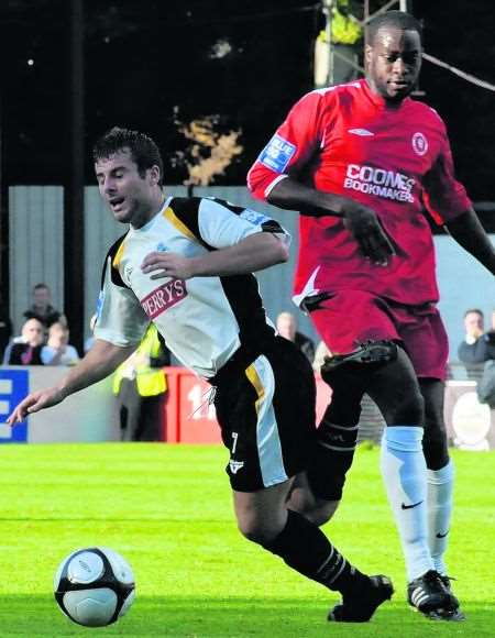 Dover's Jon Wallis is outmuscled by his Welling opponent
