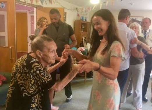 Founder Susan dancing with her mother who attends the cafe sessions