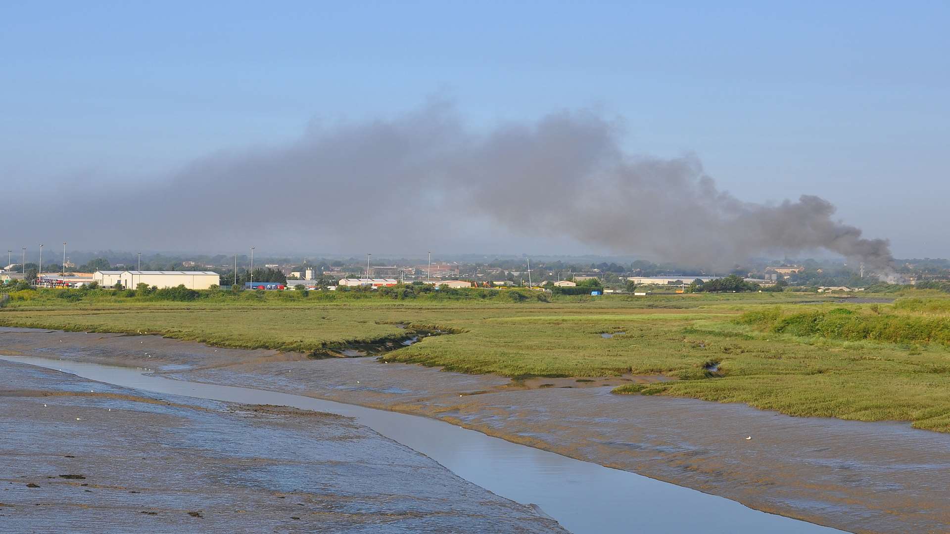 As the fire died down, a plume of smoke was still visible across the Sittingbourne skyline. Picture: Andy Ives