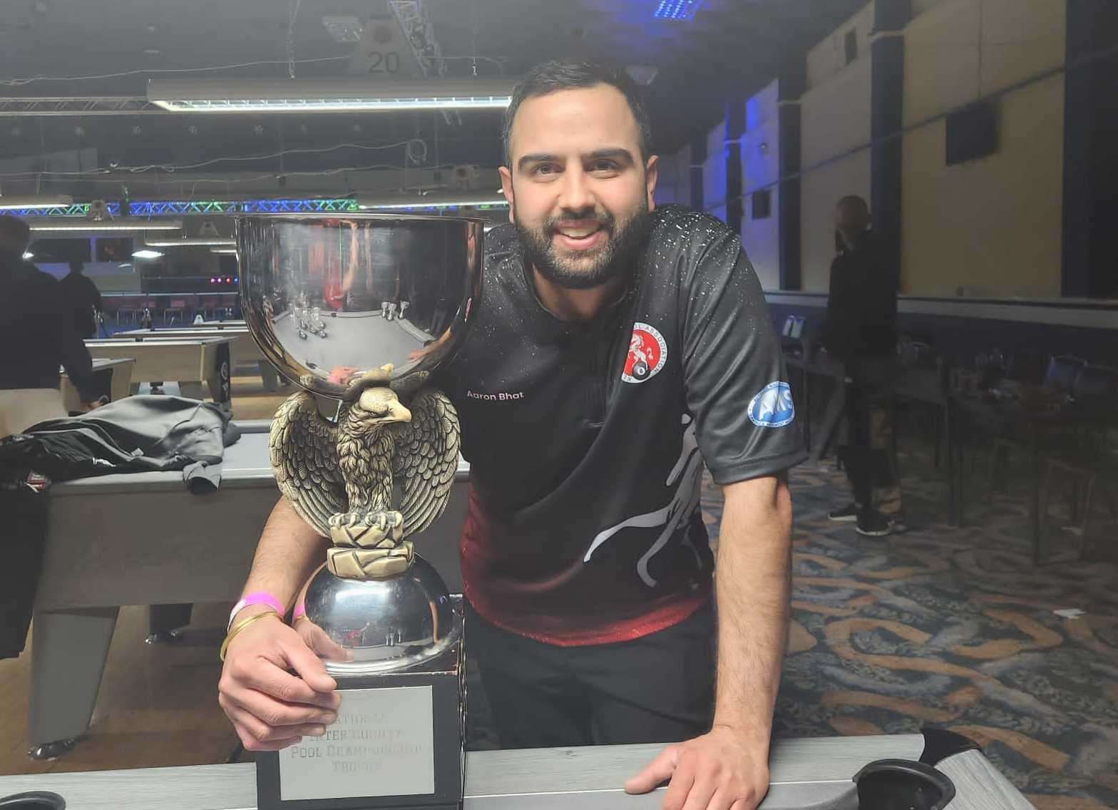 Aaron Bhat of Canterbury with the trophy