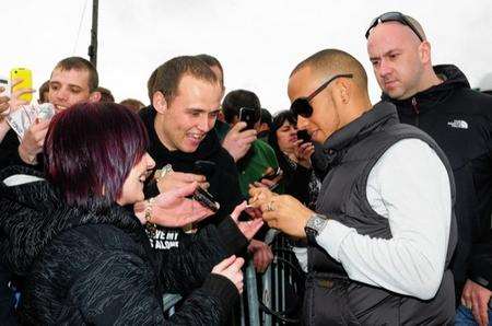 Lewis and Anthony Hamilton supporting Nicolas Hamilton in his first motor race at Brands Hatch. Lewis signs some autographs while he was there.