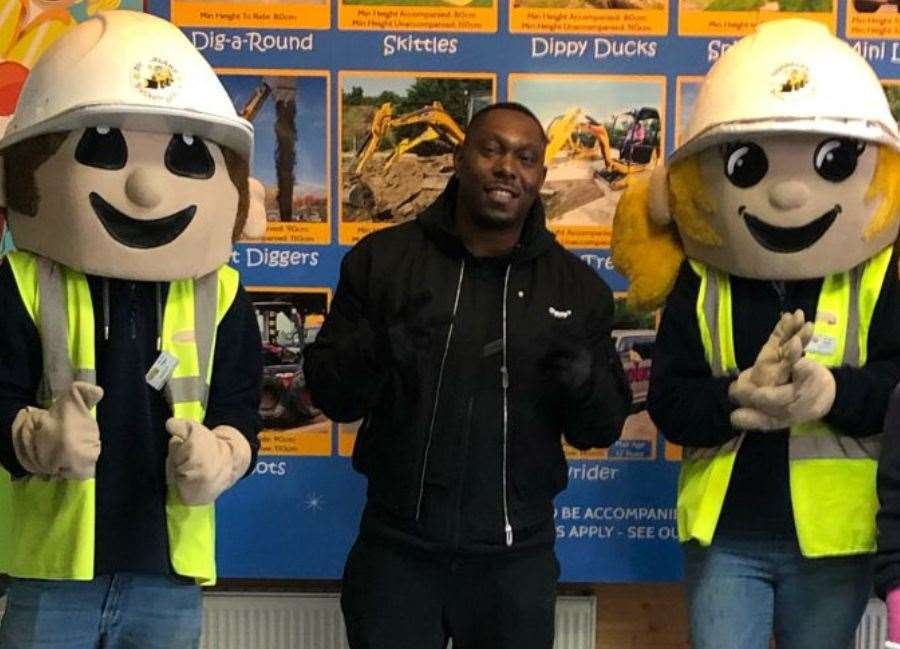 Dizzee Rascal posed with Diggerland mascots