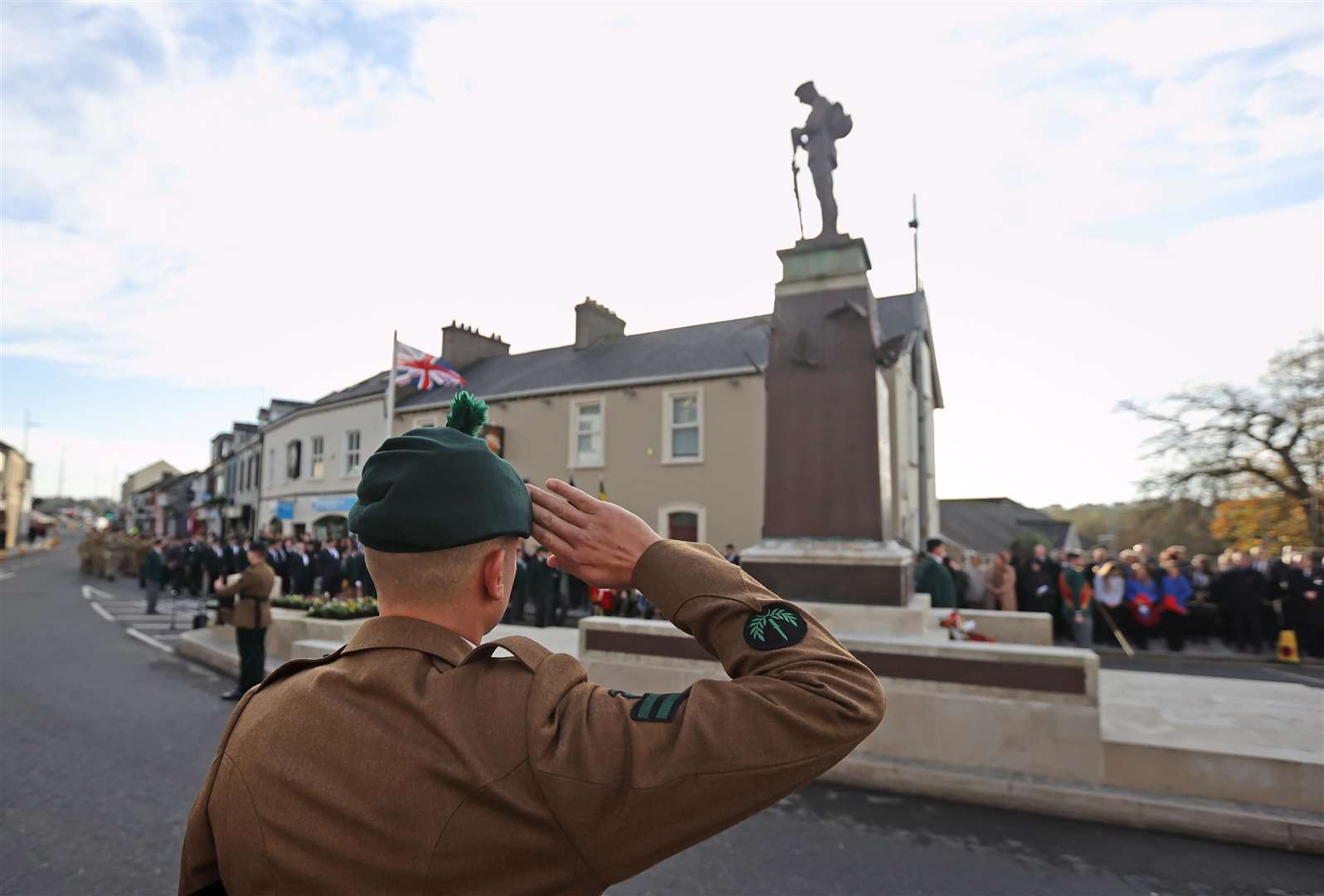 A soldier salutes during the Remembrance Sunday service at the cenotaph in Enniskillen (Liam McBurney/PA)