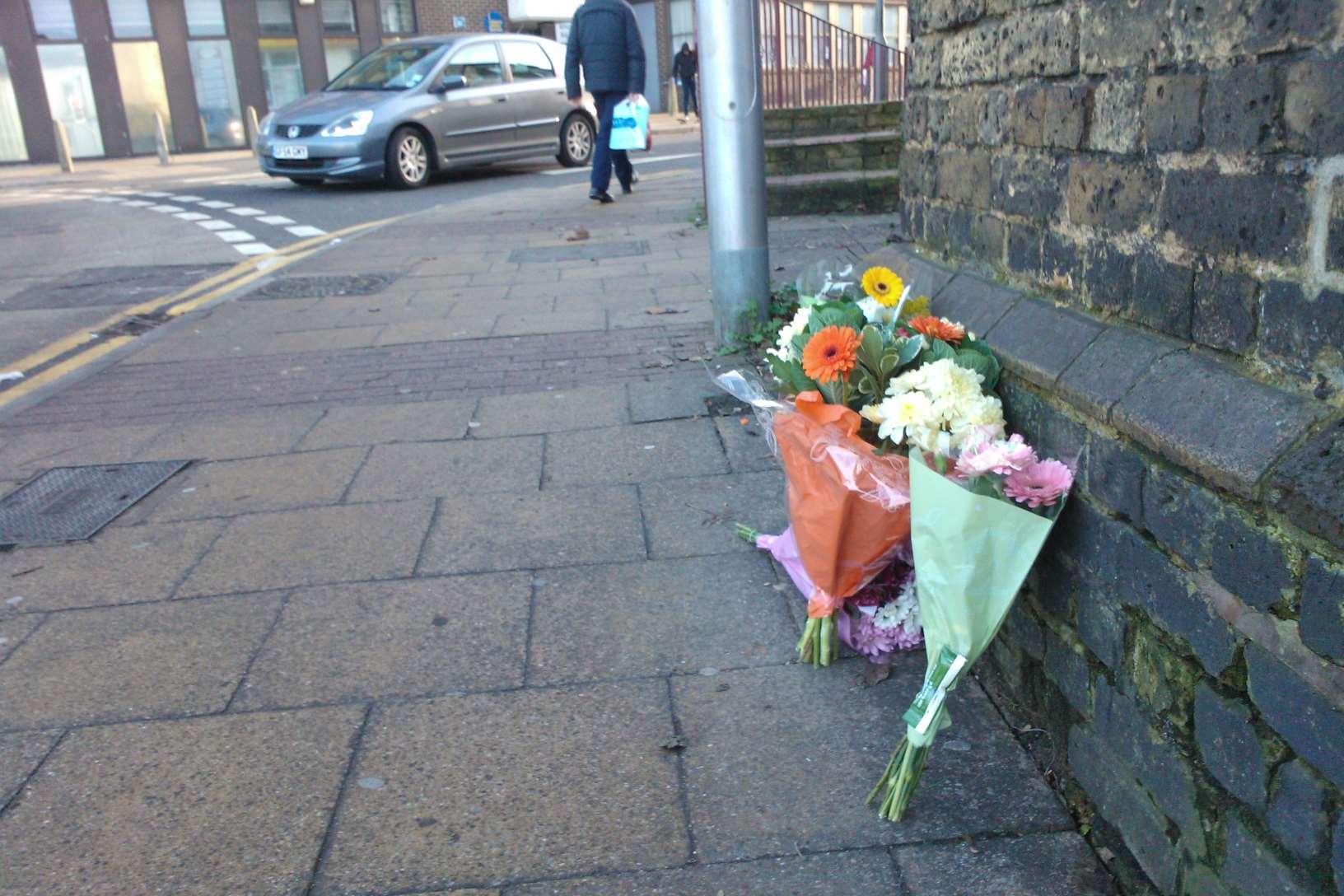 Floral tributes left at the scene opposite Gillingham Train Station