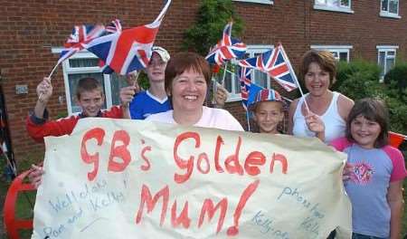 ELATED: Kelly's mother Pam Thomson celebrates with neighbours. Picture: MATT WALKER