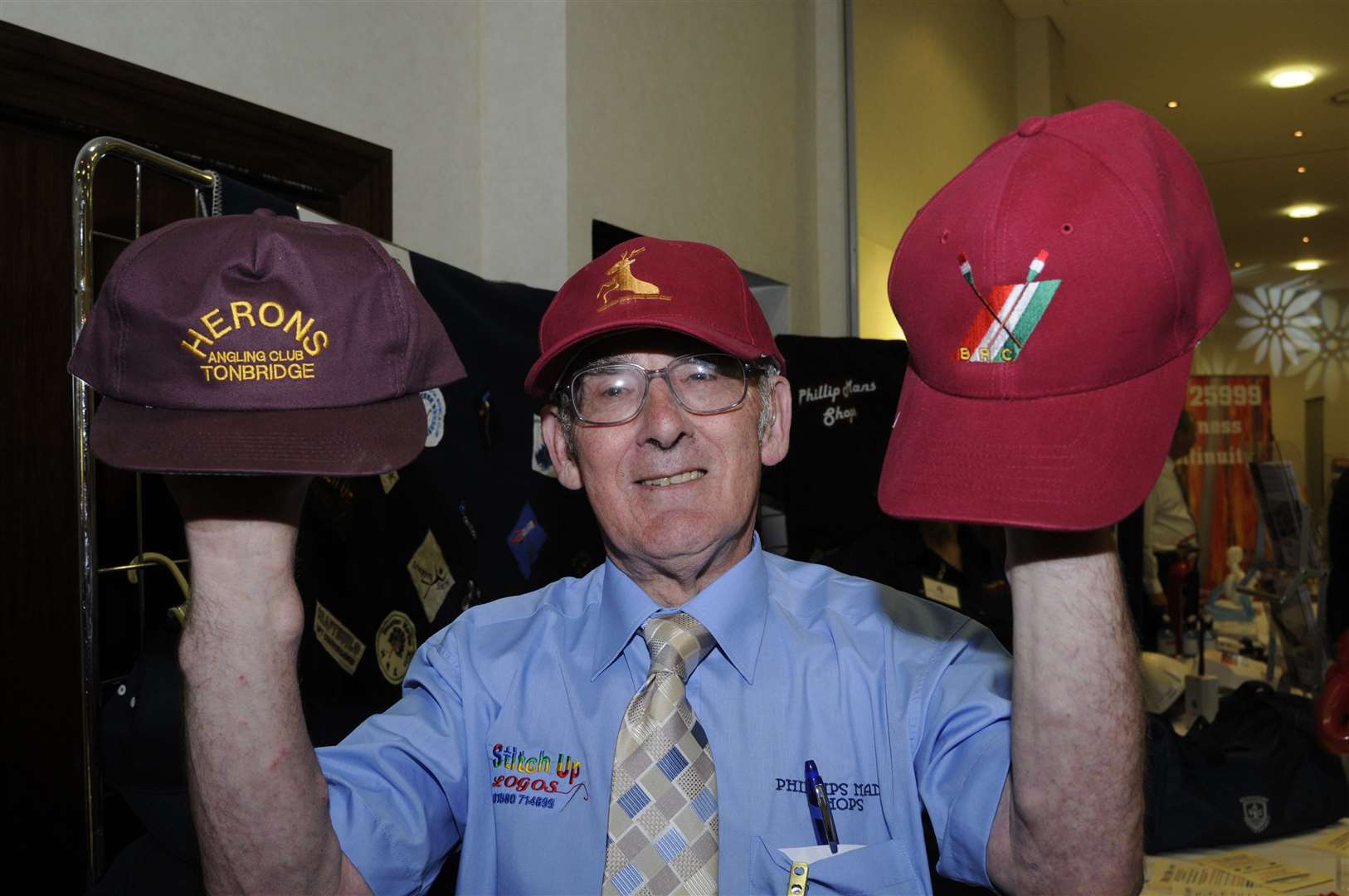 Phil Mummery at a business exhibition at the Ashford International Hotel with his promotional caps
