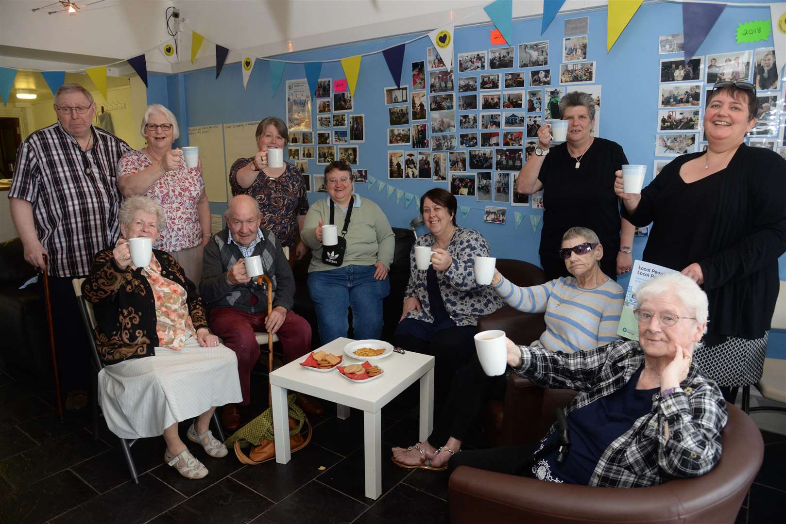 Volunteers and customers enjoying tea and coffee at a previous gathering at Net Community Hub