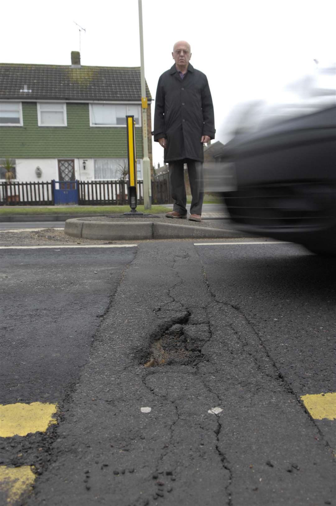 George Galdies railed against half-hearted council pothole repairs on Brookfield road. Picture : Gary Browne