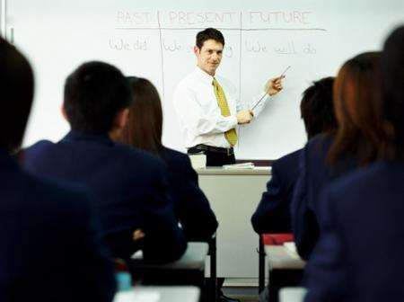 Teacher in a classroom. Stock picture