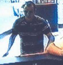 CCTV pic appeal for robbery at William Hill, Ashford