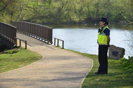 Police at the scene where a body was pull from Mote Park lake