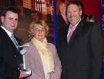 PEOPLE’S CLUB: Jason Wild and Wendy Fitzpatrick receive their award from BBC presenter Geoff Clark