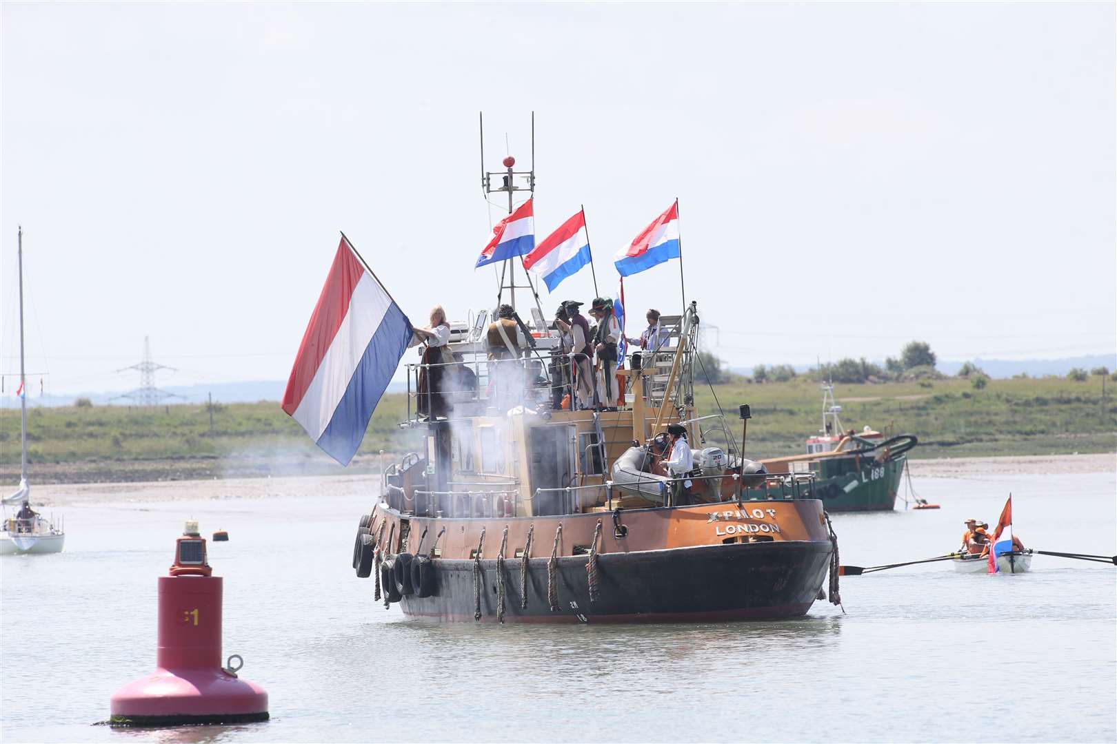 Sheppey Pirates, with Dutch flags flying, re-enact a part of the Dutch flotilla invading Queenborough during the 50th Anniversary of the Official handing back of Queenborough by the Dutch. Picture: John Westhrop