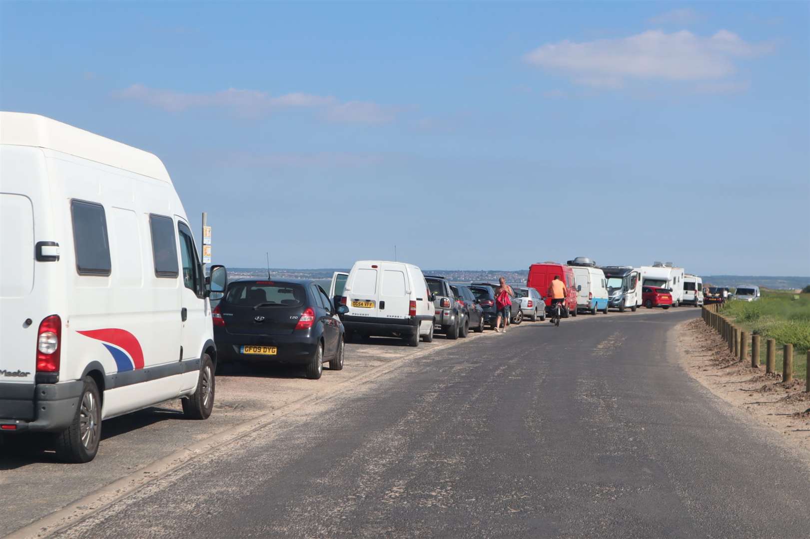 Motorhomes and campervans parked along the seawall at Shellness, Leysdown, Sheppey