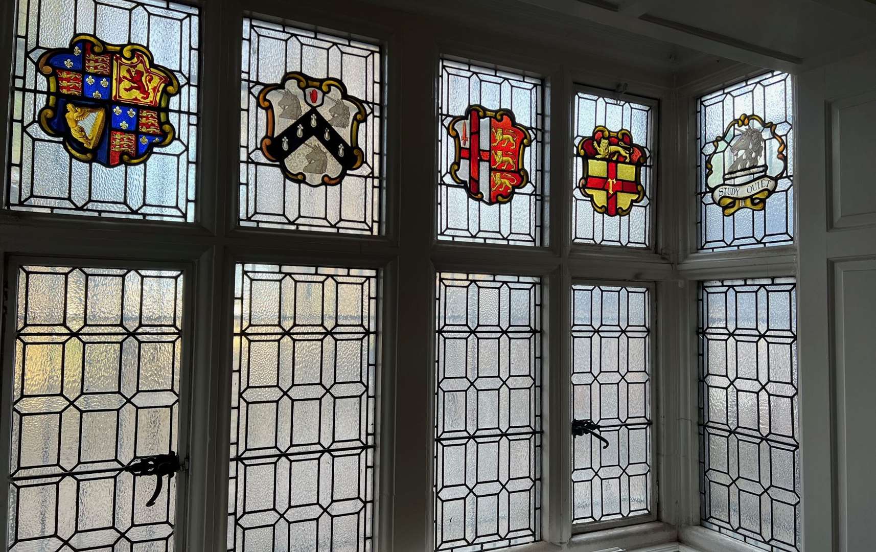 Intricate stained glass windows at the former historic townhouse