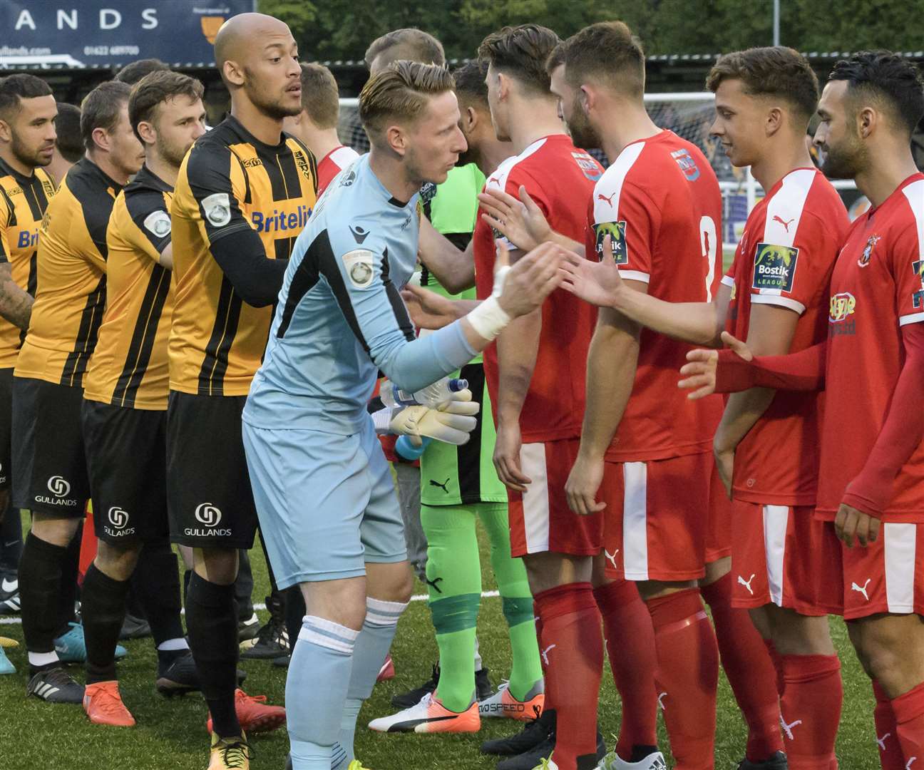 Skipper Lee Worgan leads Maidstone in the pre-match handshakes Picture: Andy Payton