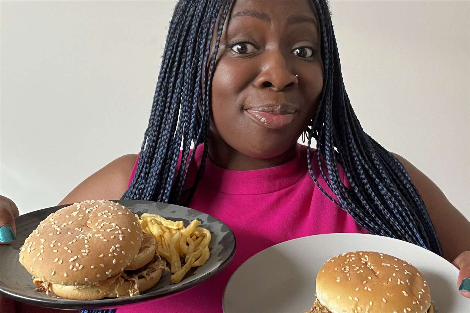 Naa Adjeley with the nine-month-old Big Mac and four-month-old McPlant burger. Picture: tsofanye