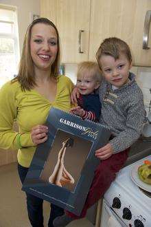 Gemma with her calendar image and sons Alastair, 1, and Frederick, 4
