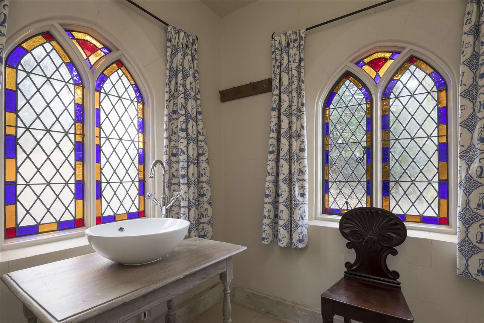 The re-made stained glass windows match the neighbouring Hall. Picture: Savills