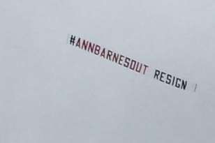 The aircraft banner saying 'Ann Barnes out - resign'