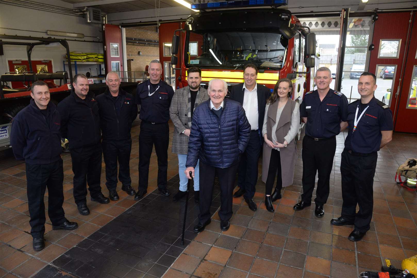 Former firefighter Doug Holgate with current crew members and his family at Strood Fire Station during his visit on Friday. Picture: Chris Davey