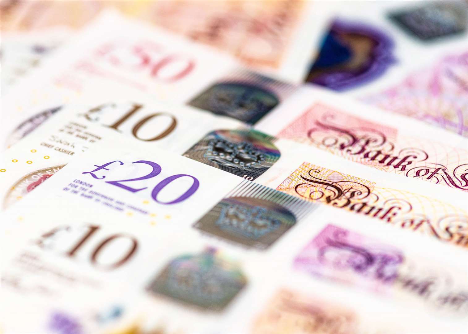 Macro image of several GBP notes issued by the Bank of England, including £10, £20 and £50 banknotes. From iStock for the Next Step