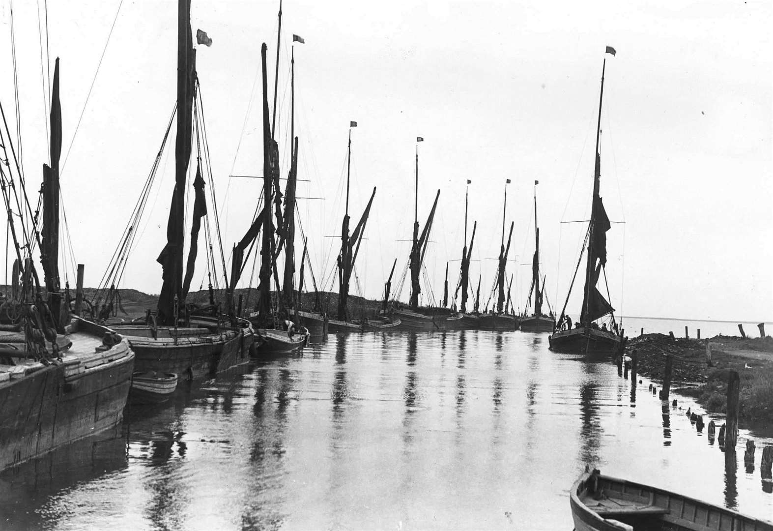 Barges line up in the creek at Lower Halstow waiting to be loaded from the brickworks in 1934