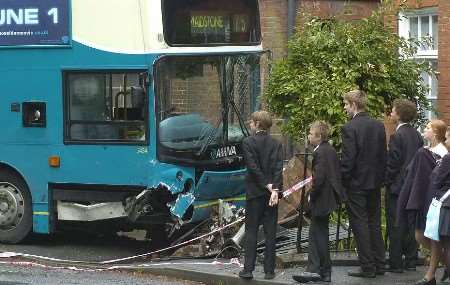 Pupils inspecting the damage to the bus shortly after the collision. Picture: GRANT FALVEY